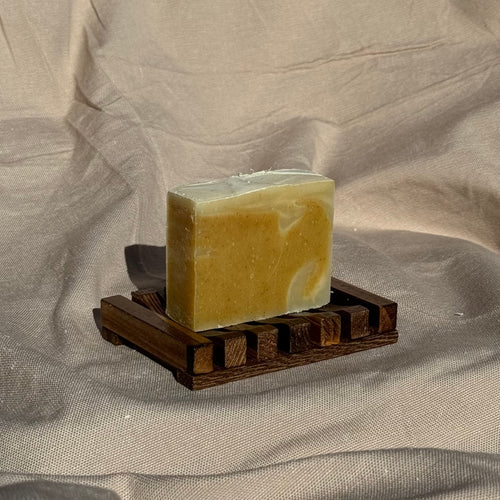 Handmade Soap Club Patchouli and Ylang Ylang body bar soap with a natural, earthy appearance and floral accents.