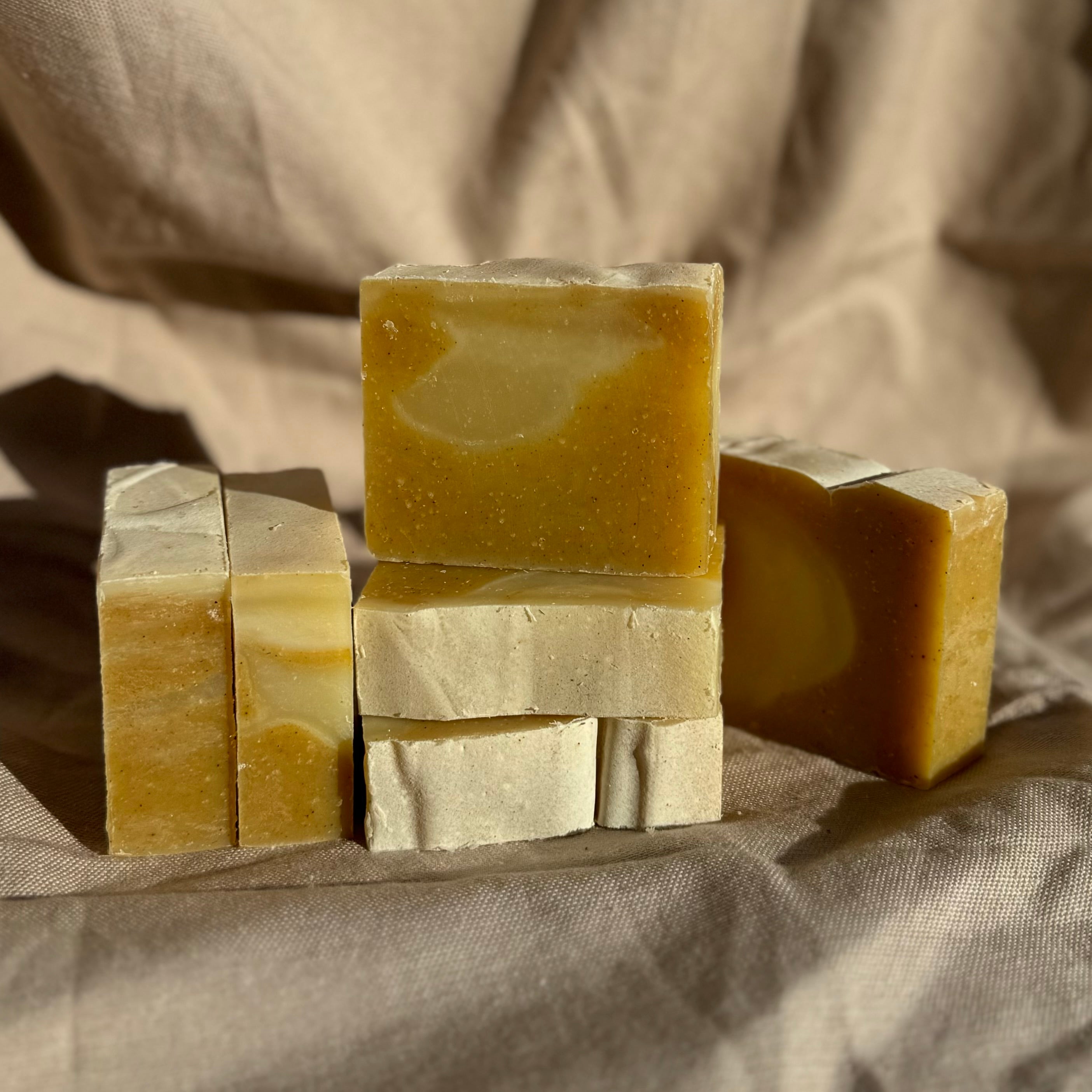 Handmade Soap Club Patchouli and Ylang Ylang body bar soap with a natural, textured appearance and floral scent.