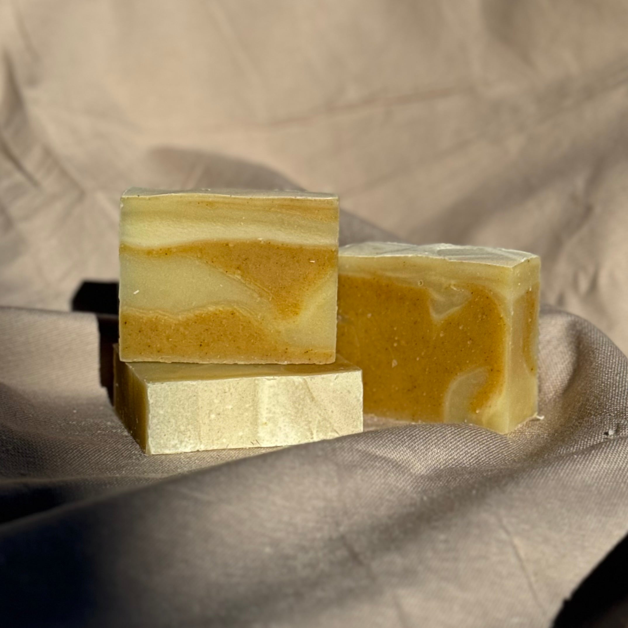 Handmade Soap Club Patchouli & Ylang Ylang body bar soap with floral and earthy scent, showing the rectangular soap bar with textured surface.