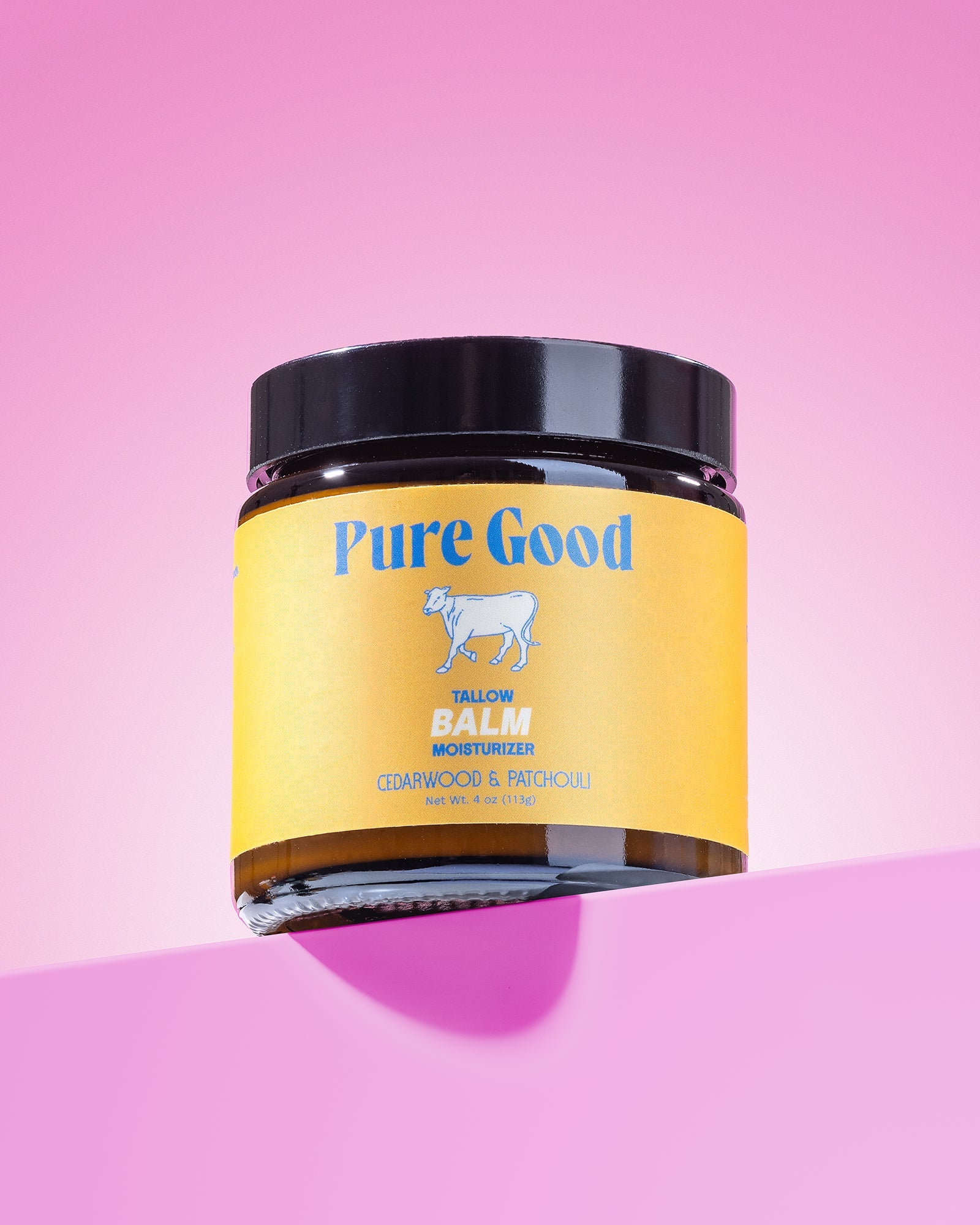 Cedarwood and patchouli tallow balm by Pure Good LLC in a 4oz jar, showcasing a natural, nourishing skincare product.