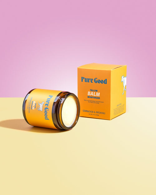 Cedarwood and patchouli tallow balm by Pure Good LLC, 8oz jar showing the natural balm texture and herbal scent ingredients.