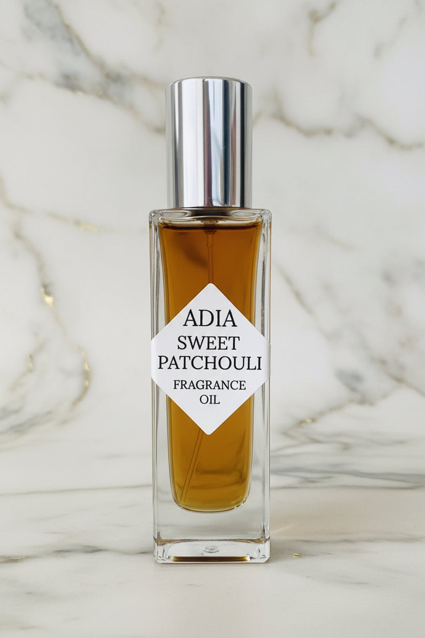 Sweet Patchouli natural fragrance oil by Adia Oils, featuring a glass bottle with a dropper and a patchouli scent illustration.