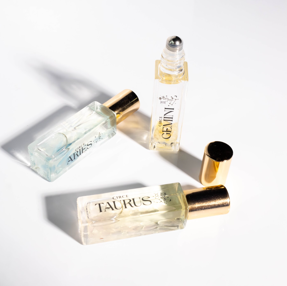 Circe Boutique Zodiac Perfume Oil Set with 12 gemstone-infused zodiac scents in elegant bottles.