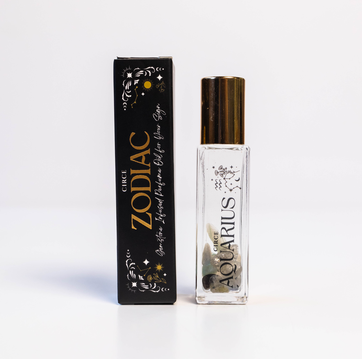 Zodiac Perfume Oil Set featuring 12 gemstone-infused zodiac scents in elegant bottles, by Circe Boutique.