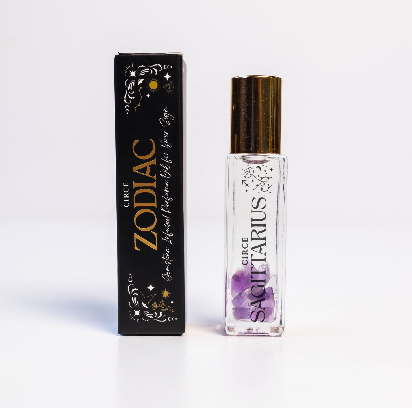 Zodiac Perfume Oil Set by Circe Boutique featuring 12 gemstone-infused zodiac scent bottles arranged in a display.