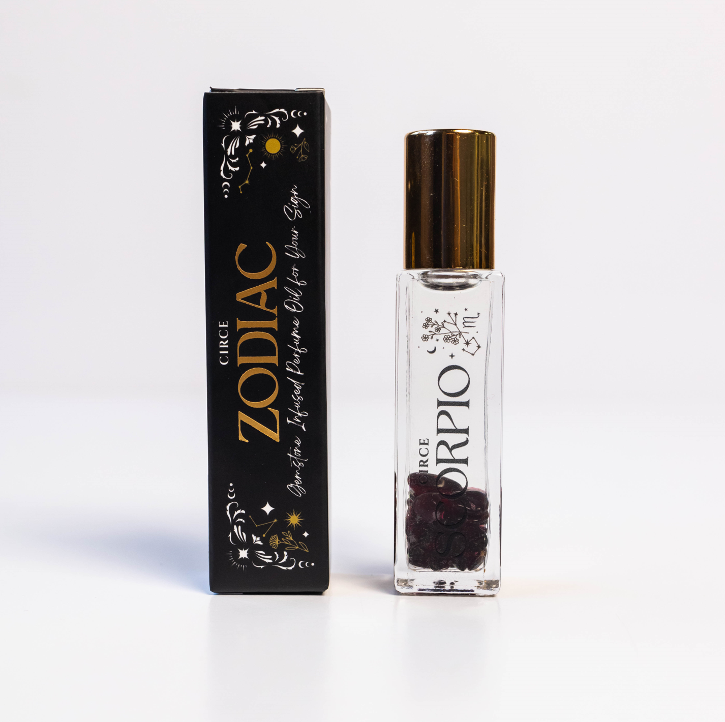 Zodiac Perfume Oil Set by Circe Boutique featuring 12 gemstone-infused zodiac scents in elegant bottles.