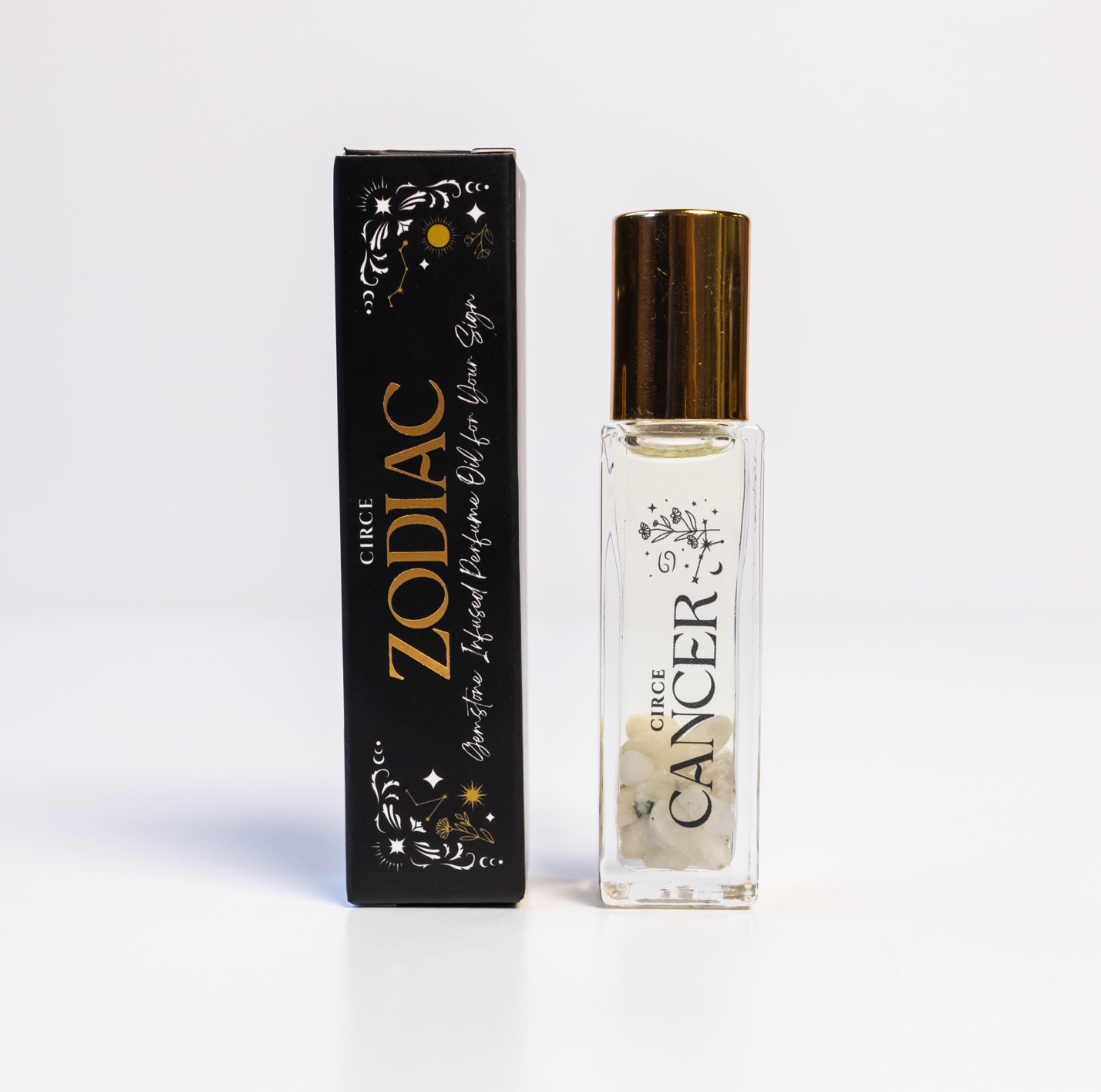 Zodiac Perfume Oil Set by Circe Boutique featuring 12 gemstone-infused zodiac scents in glass bottles.