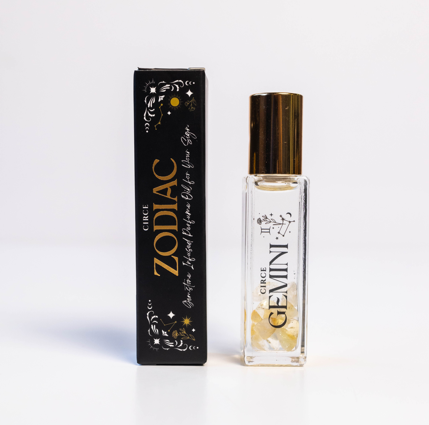 Zodiac Perfume Oil Set with 12 gemstone-infused scents, featuring small glass bottles with zodiac symbols and vibrant labels.