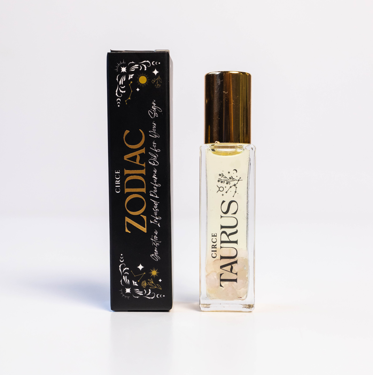 Zodiac Perfume Oil Set by Circe Boutique featuring 12 gemstone-infused zodiac scent bottles arranged in a display.